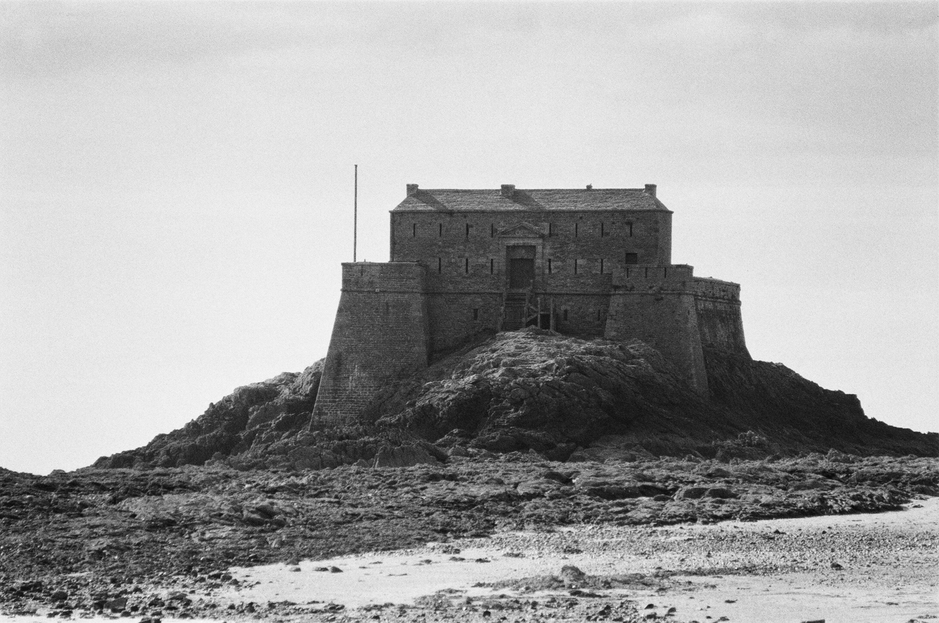 Anders brand wordmark in white placed on top of an image of a modern interior design.