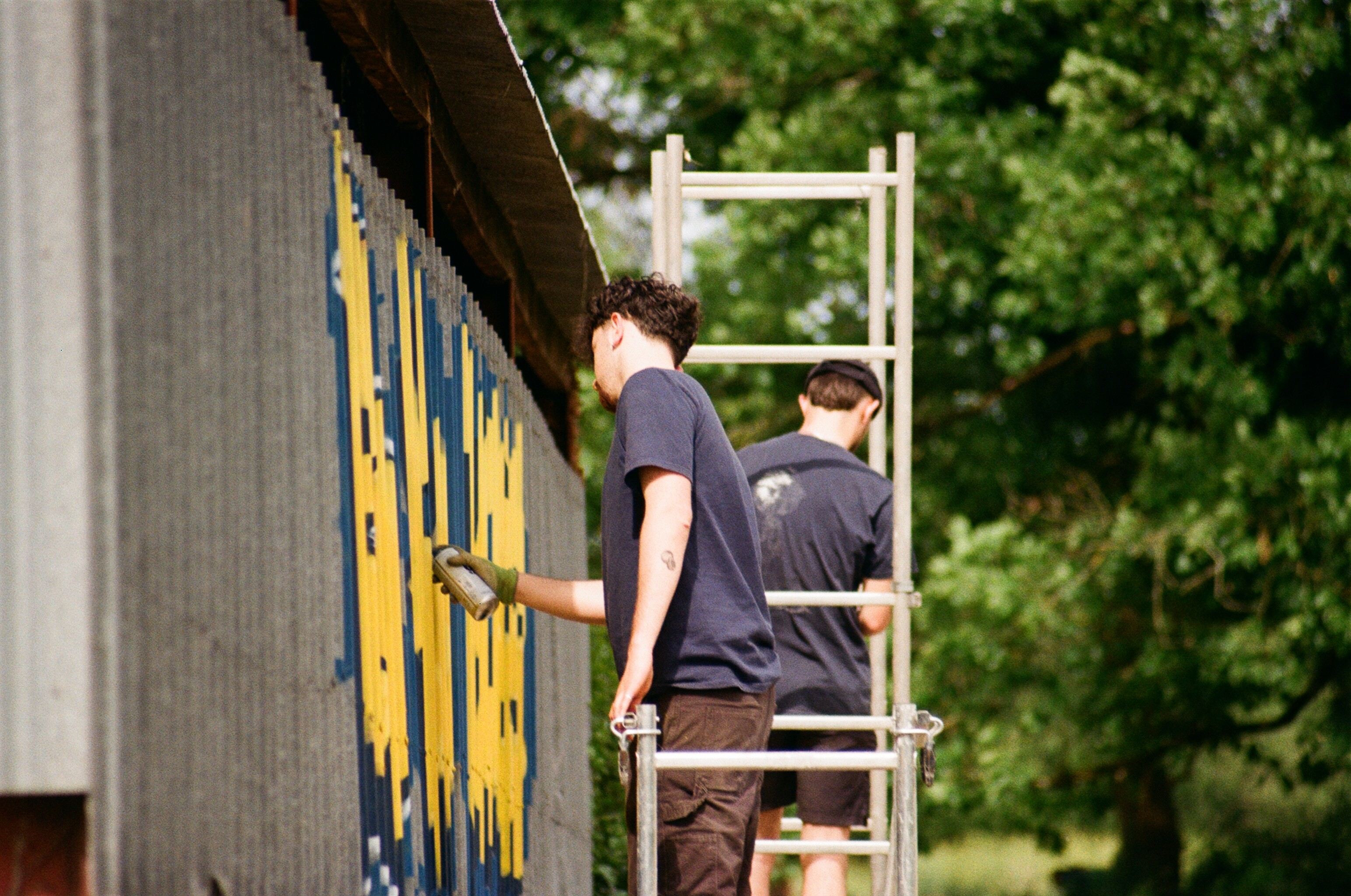 Stationery design of letterhead and business cards for the company Anders on top of a blurred photo of a house interior.